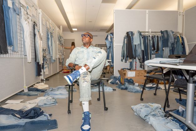 Demetrius among pairs of jeans